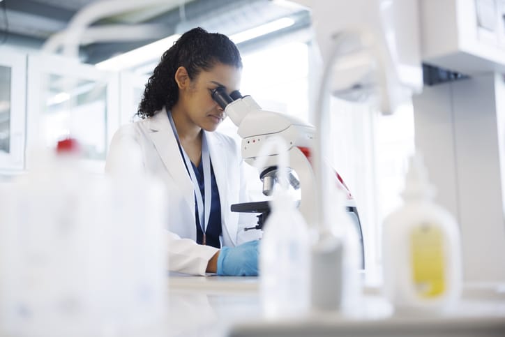 Photo shows a female scientist working in a laboratory/Getty Images