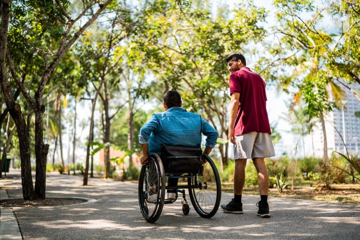 Friends talking and walking on public park