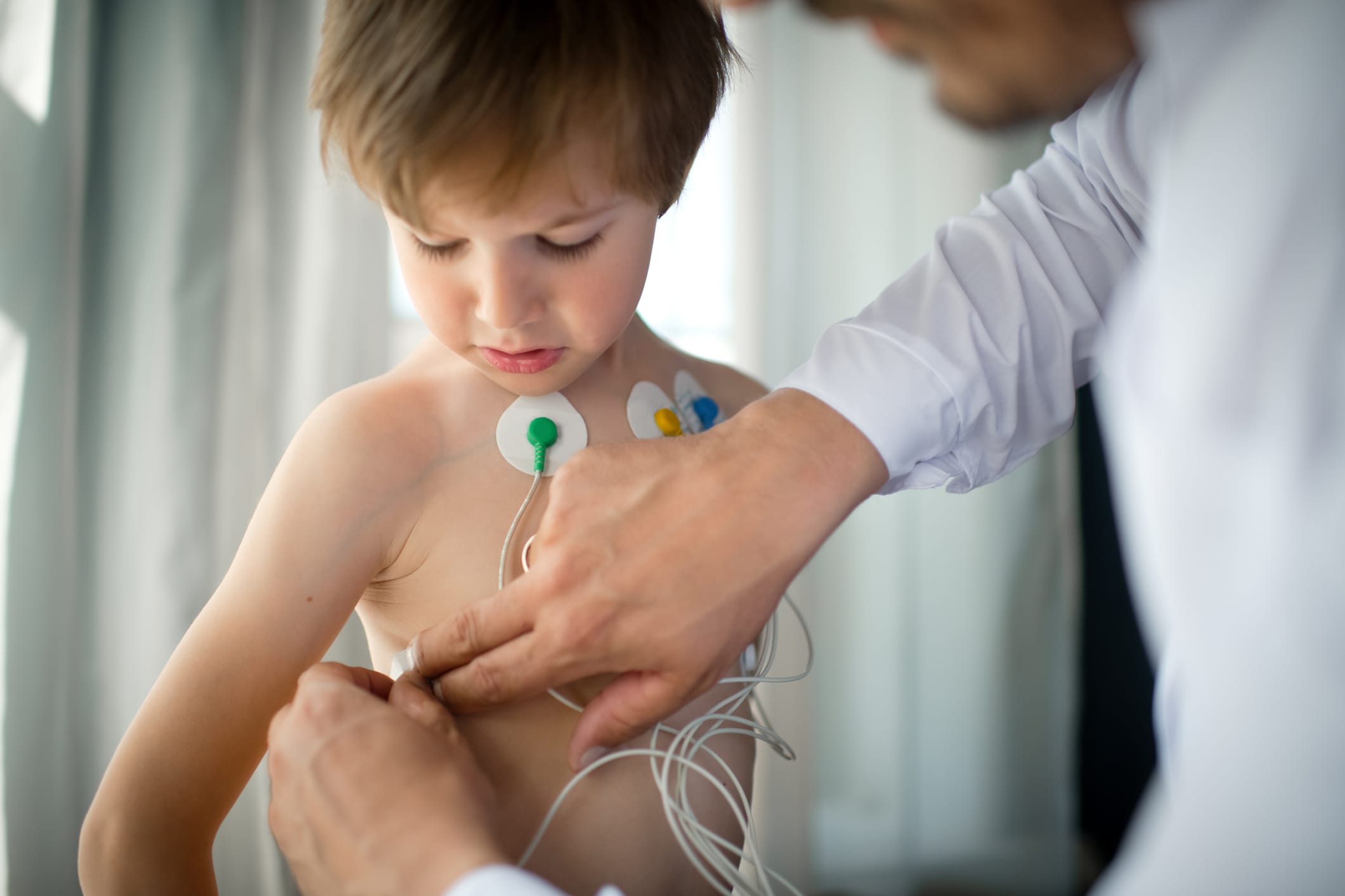 Little boy at a doctor's office being prepped for an ECG