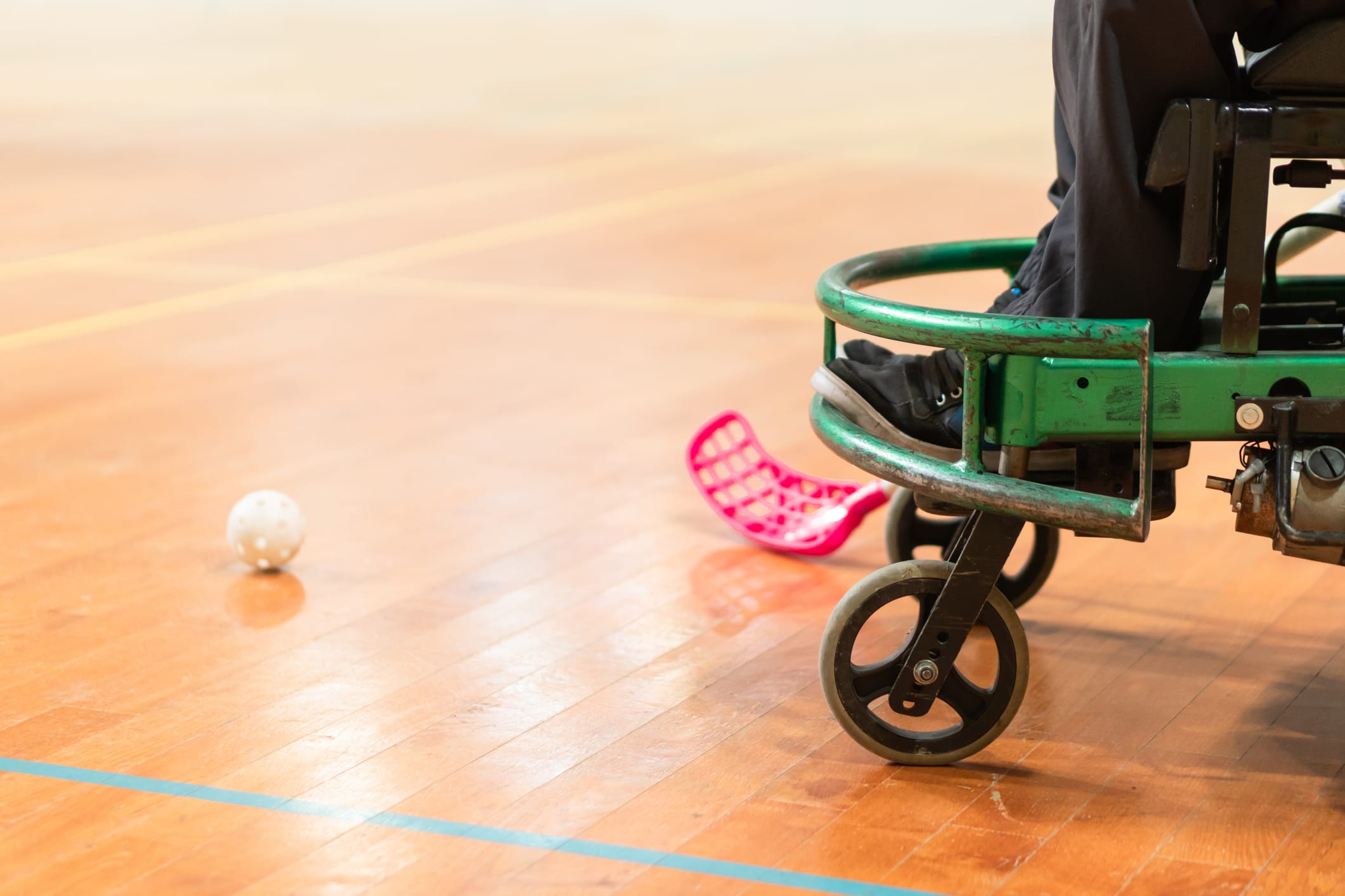 Photo of disabled man on a wheelchair playing sports