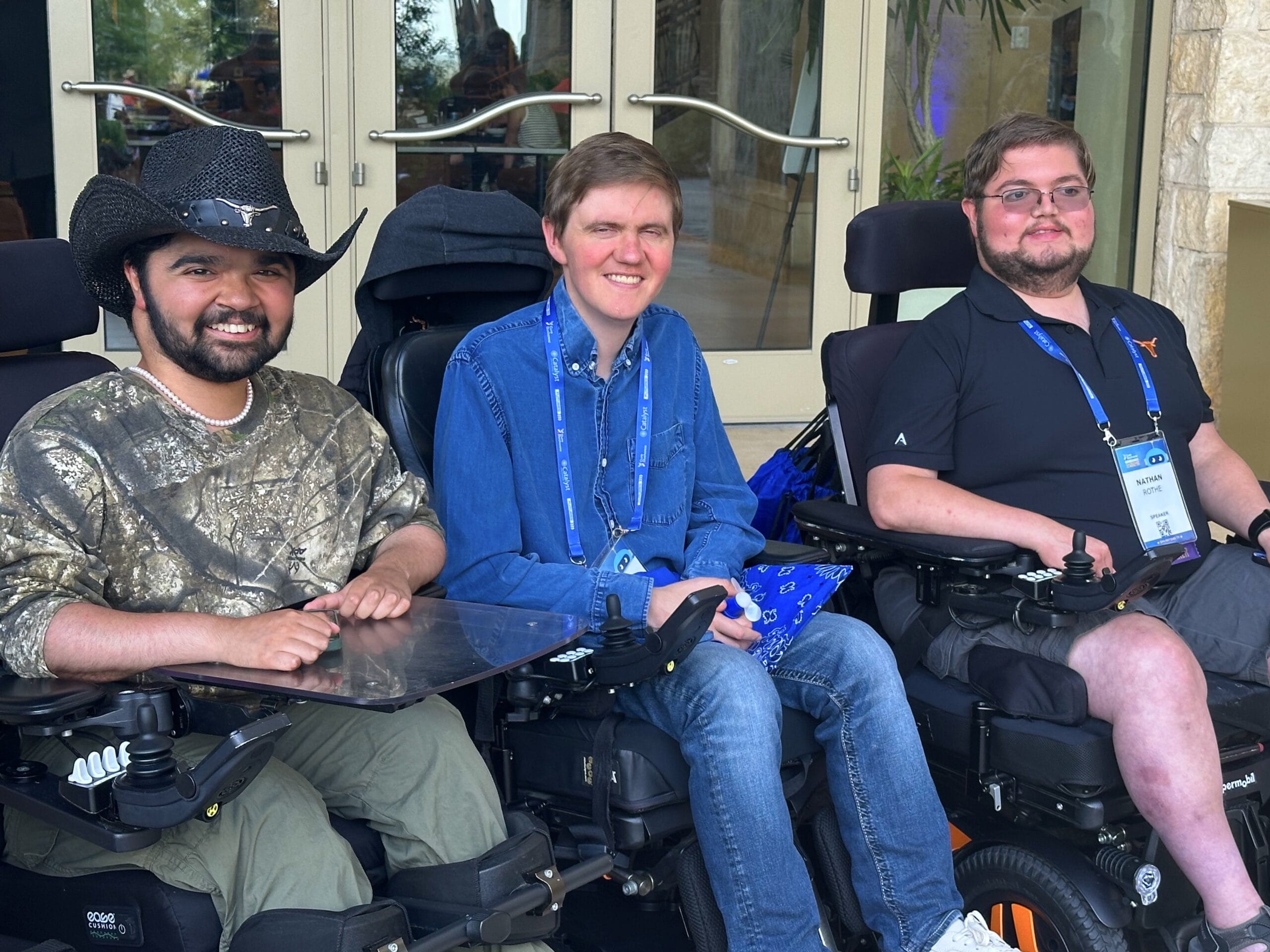 From left: Yuva Gambhir, Hawken Miller (moderator) and Nathan Rothe, all of whom have Duchenne muscular dystrophy, between sessions at CureDuchenne’s 2025 Futures Conference in San Antonio, Texas