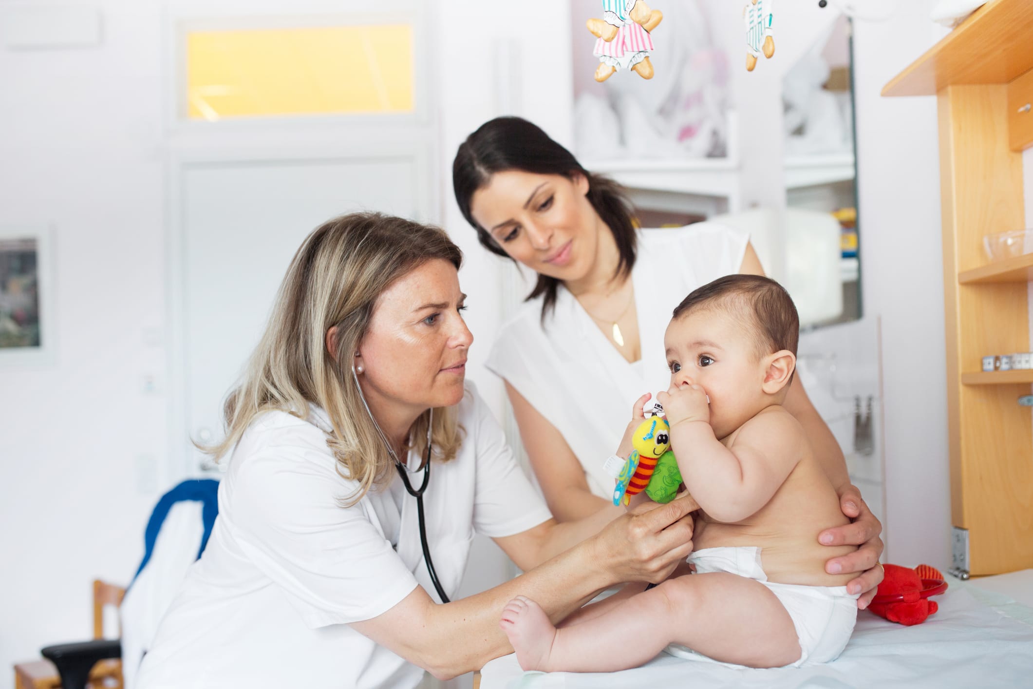 Baby being examined by doctor