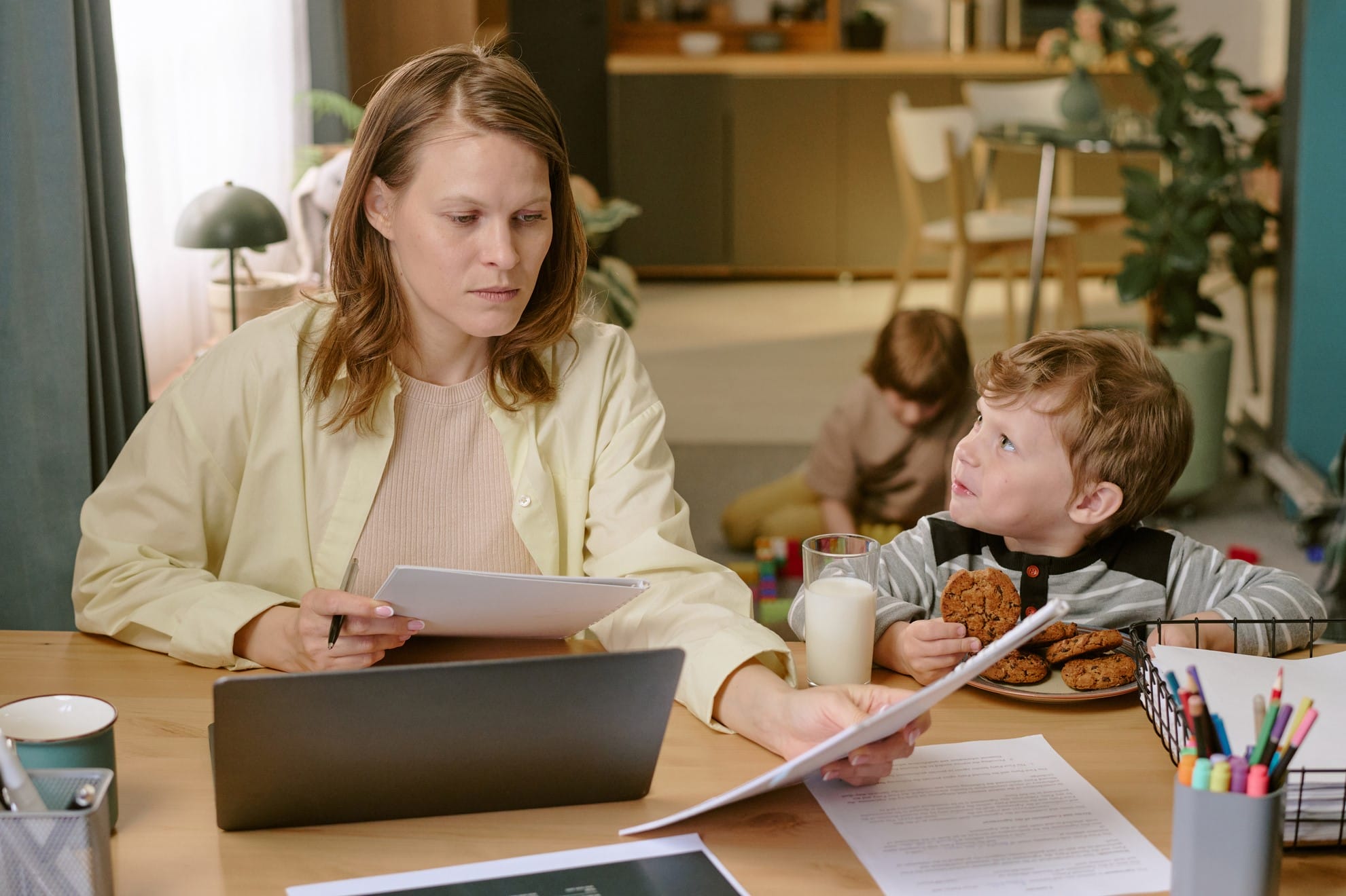 Busy mom organizing son's paperwork
